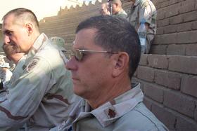 Colonel Michael Whitehead observing the ceremony from the stadium seats.